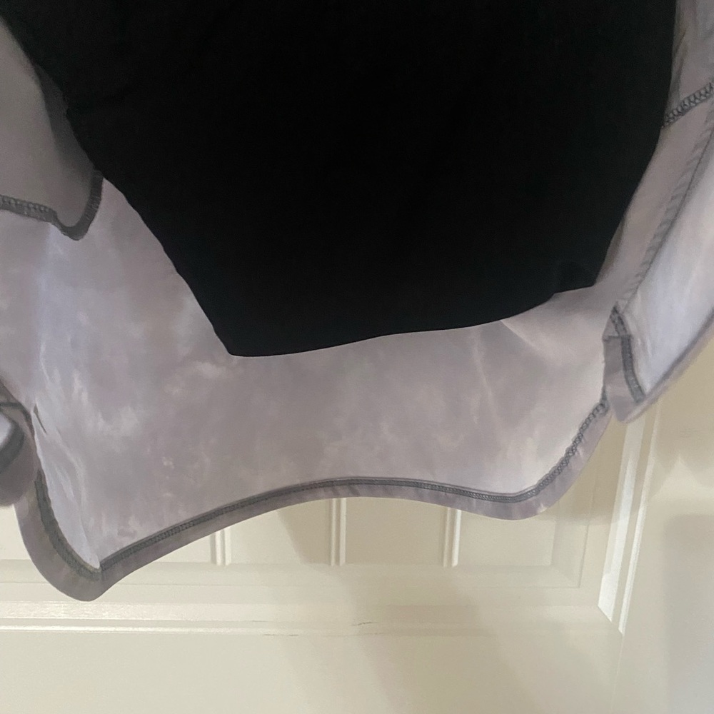 Gray marble print pull on polyester knit skirt with waist tie.